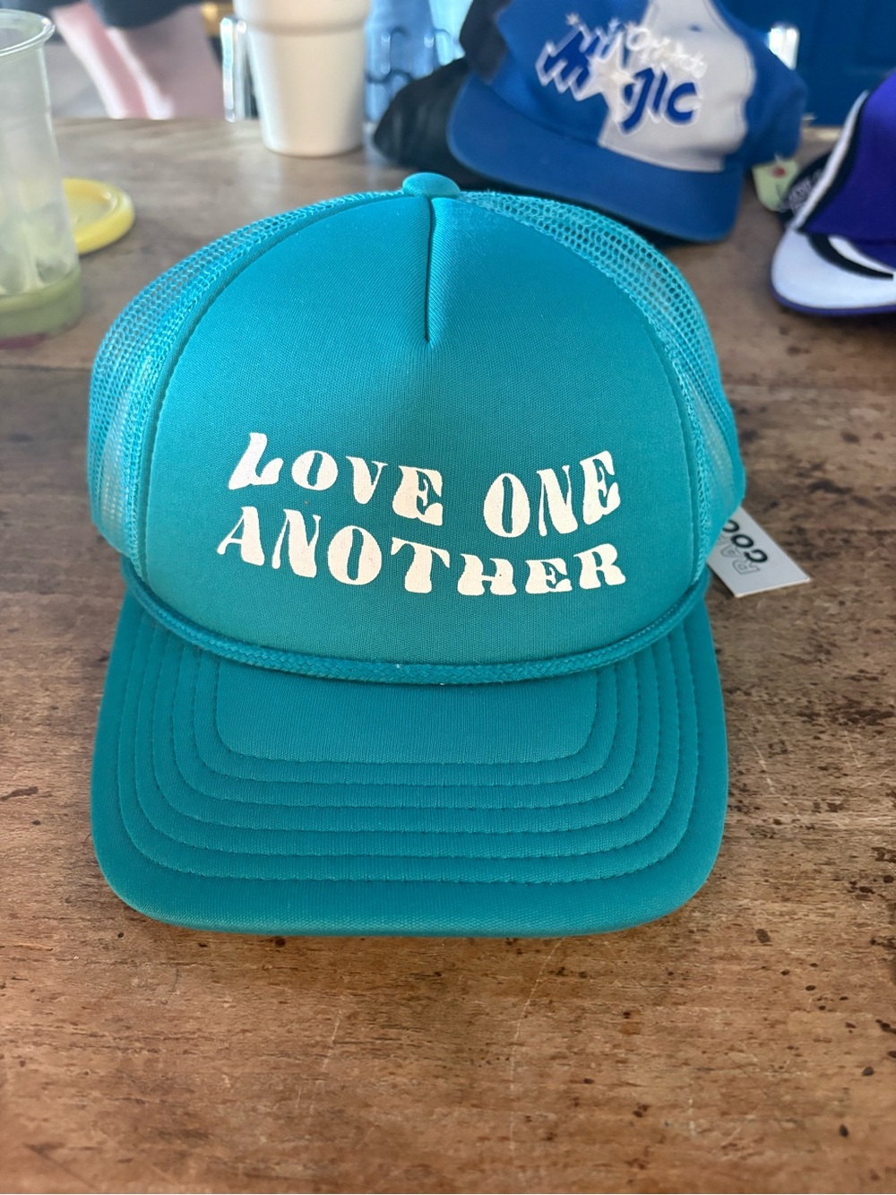 Urban Outfitters Teal Trucker Hat with "Love One Another" Print